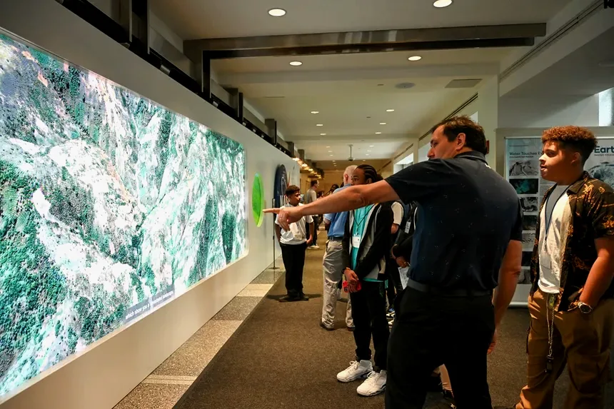 Visitors exploring the Earth Information Center at NASA Headquarters
