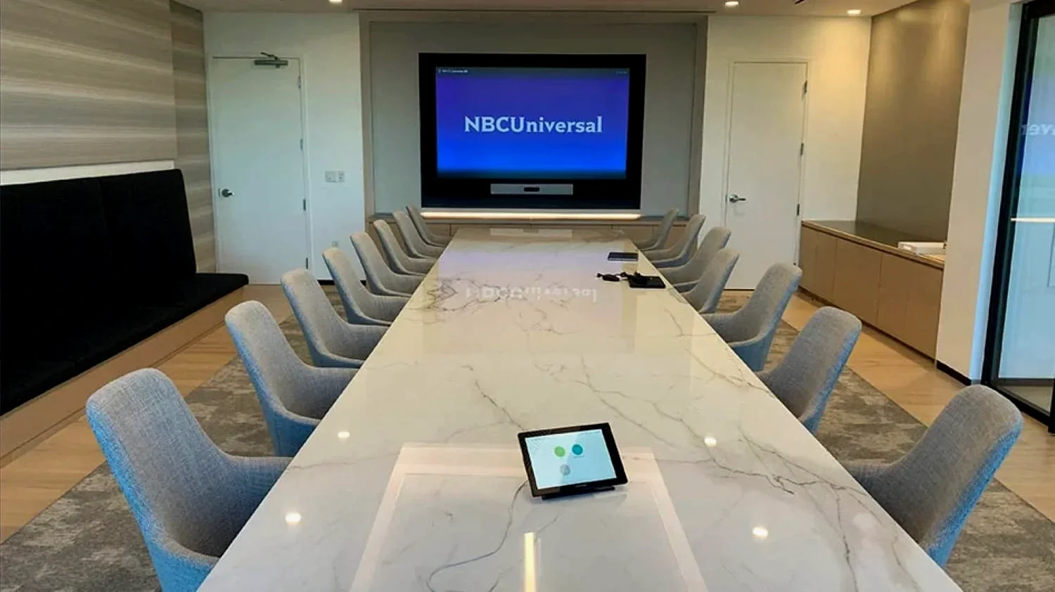 NBCUniversal boardroom with integrated displays and conferencing